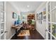 Bright home office with hardwood floors, lots of artwork, and natural light at 2315 Saddle Brook Trce, Cumming, GA 30040