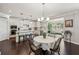 Open kitchen and breakfast nook boasts stainless appliances, granite counters, and hardwood floors at 2315 Saddle Brook Trce, Cumming, GA 30040