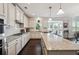 Well-lit kitchen featuring stainless steel appliances, granite countertops, and a large central island at 2315 Saddle Brook Trce, Cumming, GA 30040
