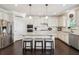 Bright kitchen with granite counters, stainless appliances and a center island with barstool seating at 2315 Saddle Brook Trce, Cumming, GA 30040