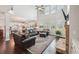 Spacious living room with hardwood floors, fireplace and many windows at 2315 Saddle Brook Trce, Cumming, GA 30040