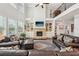 Bright living room with vaulted ceilings, fireplace, built-ins and staircase to second floor at 2315 Saddle Brook Trce, Cumming, GA 30040