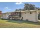 View of the backyard with covered porch at 2376 Falls River Dr, Lithia Springs, GA 30122