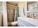 Bathroom featuring a vanity with a white countertop and beadboard cabinets and a shower-tub combination at 2376 Falls River Dr, Lithia Springs, GA 30122