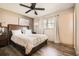 Bedroom featuring wood-look floors, a ceiling fan, and natural light at 2376 Falls River Dr, Lithia Springs, GA 30122