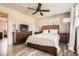 Bedroom featuring wood-look floors, a ceiling fan, and natural light at 2376 Falls River Dr, Lithia Springs, GA 30122