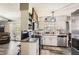 Updated kitchen features stainless steel appliances and adjacent dining space at 2376 Falls River Dr, Lithia Springs, GA 30122