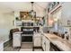 Cozy kitchen with white cabinets, stainless steel appliances, and decor at 2376 Falls River Dr, Lithia Springs, GA 30122