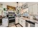 Cozy kitchen with white cabinets, stainless steel appliances, and decor at 2376 Falls River Dr, Lithia Springs, GA 30122