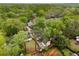 Aerial view of a charming home with lush trees and a detached garage with finished space above at 286 Norwood Ne Ave, Atlanta, GA 30317
