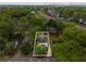 Aerial view of a home surrounded by lush greenery, with the city skyline in the distance at 286 Norwood Ne Ave, Atlanta, GA 30317