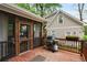 Exterior deck with a grill, outdoor seating, and a view of the backyard at 286 Norwood Ne Ave, Atlanta, GA 30317