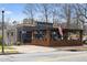 The Marlay restaurant features a charming brick patio, covered pergola, and an inviting entrance on a sunny day at 286 Norwood Ne Ave, Atlanta, GA 30317