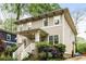 Charming two-story home featuring a cozy front porch and a well-manicured front yard at 286 Norwood Ne Ave, Atlanta, GA 30317