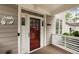 Stylish front door with glass detail, protected by a charming covered porch with detailed wood trim at 286 Norwood Ne Ave, Atlanta, GA 30317