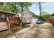 Two-car detached garage with finished space above and adjacent deck and porch at 286 Norwood Ne Ave, Atlanta, GA 30317