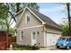Two-car detached garage with finished space above and adjacent deck and porch at 286 Norwood Ne Ave, Atlanta, GA 30317