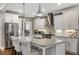 Bright kitchen with white cabinets, stainless steel appliances and granite countertops and island at 286 Norwood Ne Ave, Atlanta, GA 30317