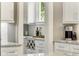 Bright kitchen featuring a wine rack, granite countertops and a stainless steel coffeemaker at 286 Norwood Ne Ave, Atlanta, GA 30317