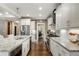Bright kitchen featuring white cabinets, stainless steel appliances, and granite countertops at 286 Norwood Ne Ave, Atlanta, GA 30317