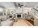 Cozy living room with a fireplace, built-in bookshelves, and hardwood floors at 286 Norwood Ne Ave, Atlanta, GA 30317