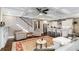 Bright, open living room with coffered ceiling and modern kitchen in the background at 286 Norwood Ne Ave, Atlanta, GA 30317