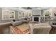 Spacious living room featuring a fireplace, built-in shelving, and comfortable seating at 286 Norwood Ne Ave, Atlanta, GA 30317