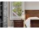 Cozy main bedroom with beautiful natural light and neutral decor at 286 Norwood Ne Ave, Atlanta, GA 30317
