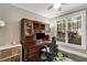 Charming home office with custom wood built-ins and ample natural light at 286 Norwood Ne Ave, Atlanta, GA 30317