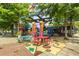Exterior of a colorful restaurant with outdoor picnic tables and shaded seating at 286 Norwood Ne Ave, Atlanta, GA 30317