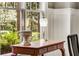 Side table by a window in a dining room, which provides natural light for the room at 286 Norwood Ne Ave, Atlanta, GA 30317