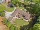Stunning aerial view of a landscaped single-Gathering home with an expansive driveway and lush surroundings at 299 Saint Marys Nw Ln, Marietta, GA 30064
