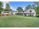 Large backyard, with a manicured lawn, and professional landscaping at 299 Saint Marys Nw Ln, Marietta, GA 30064