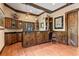 This wet bar has rustic wood finishes, stylish lighting, and an adjacent door at 299 Saint Marys Nw Ln, Marietta, GA 30064