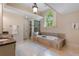Bathroom featuring a soaking tub with tile surround, a shower, and a vanity with marble countertops at 299 Saint Marys Nw Ln, Marietta, GA 30064
