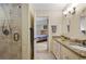 Bathroom with tiled walk-in shower, granite countertops and views into the main bedroom at 299 Saint Marys Nw Ln, Marietta, GA 30064