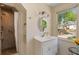 Bright bathroom featuring a shower with glass door and white vanity with granite countertop at 299 Saint Marys Nw Ln, Marietta, GA 30064