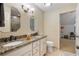 Bright bathroom features double sinks with granite countertops and a view into the adjacent room at 299 Saint Marys Nw Ln, Marietta, GA 30064