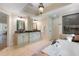 Bathroom featuring a large soaking tub, a separate shower, and dual vanities with framed mirrors at 299 Saint Marys Nw Ln, Marietta, GA 30064