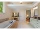Bright bathroom featuring double vanity, soaking tub and separate vanity area at 299 Saint Marys Nw Ln, Marietta, GA 30064