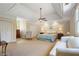 Spacious bedroom featuring tray ceiling, neutral decor, and double closets at 299 Saint Marys Nw Ln, Marietta, GA 30064