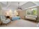 Comfortable bedroom offering tray ceilings and natural light from large windows at 299 Saint Marys Nw Ln, Marietta, GA 30064