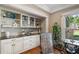 Custom built-ins offer storage and display space with a view of the yard at 299 Saint Marys Nw Ln, Marietta, GA 30064
