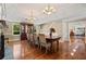 Elegant dining room with coffered ceiling, hardwood floors, and staircase access at 299 Saint Marys Nw Ln, Marietta, GA 30064