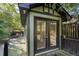 Inviting outbuilding features double doors and surrounding deck, perfect for relaxing outdoors at 299 Saint Marys Nw Ln, Marietta, GA 30064
