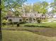 Landscaped yard leads up to a grand home with dormer windows at 299 Saint Marys Nw Ln, Marietta, GA 30064