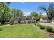 Well-manicured front yard leads to a multi-car garage, perfect for car enthusiasts and those seeking ample storage at 299 Saint Marys Nw Ln, Marietta, GA 30064