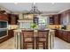 Updated kitchen featuring a central island with seating, custom cabinetry and stainless appliances at 299 Saint Marys Nw Ln, Marietta, GA 30064