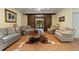 Open living room with comfortable seating, a unique coffee table, and decorative accents at 299 Saint Marys Nw Ln, Marietta, GA 30064