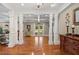 Comfortable living room featuring hardwood floors, coffered ceiling, and classic furniture at 299 Saint Marys Nw Ln, Marietta, GA 30064